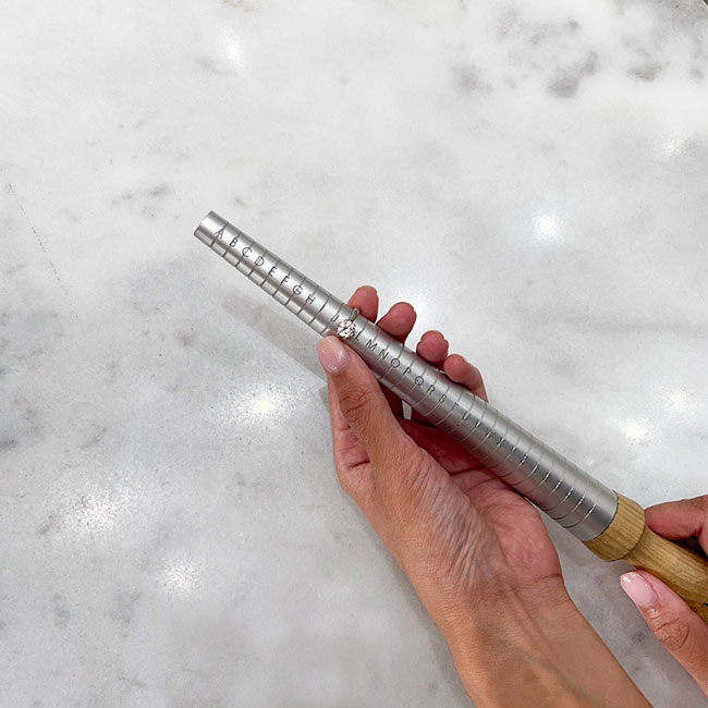 If she is right-handed then her left hand will be roughly 2 sizes smaller and vice versa.